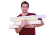 Photo: Man with rolls of wallpaper Man with rolls of wallpaper