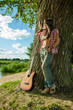Photo: Beautiful hippie girl with guitar Beautiful hippie girl with guitar