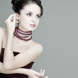 Photo: A beautiful young woman is in red clothes A beautiful young woman is in red clothes