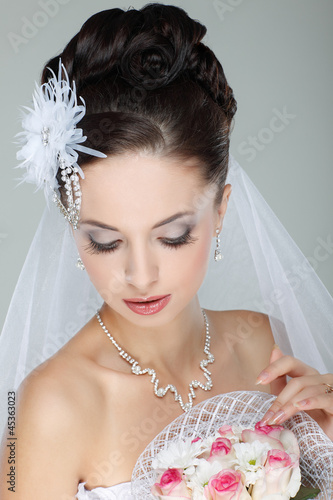 Photo: Portrait of beautiful bride. Wedding dress. Wedding decoration Portrait of beautiful bride. Wedding dress. Wedding decoration