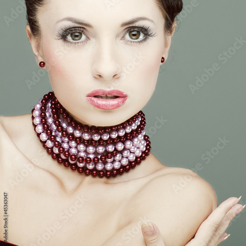 Photo: A beautiful young woman is in red clothes A beautiful young woman is in red clothes