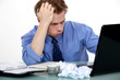 Stressed man sat at desk