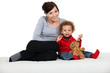Woman and child with a teddy bear