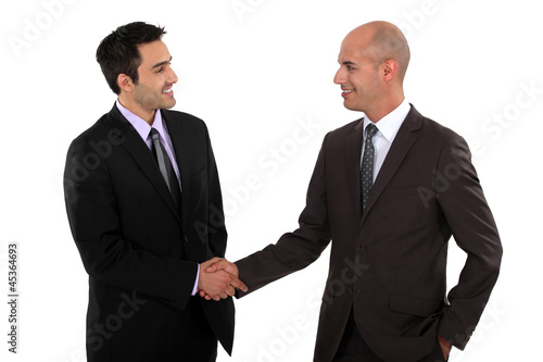 Photo: businessmen shaking hands businessmen shaking hands