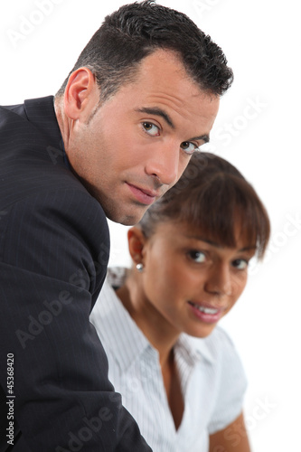 Photo: A couple of businesspeople discussing. A couple of businesspeople discussing.