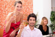 Smart couple drinking champagne at a party