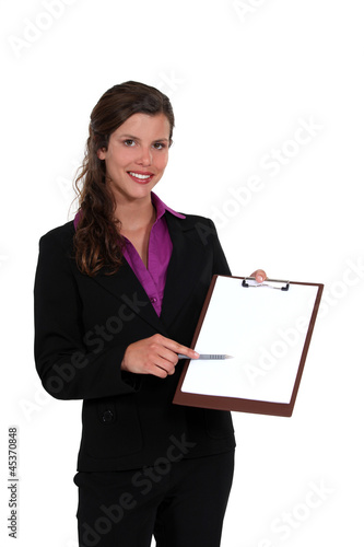Photo: Businesswoman with a blank clipboard Businesswoman with a blank clipboard