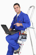 plumber with tools and laptop