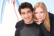 Two young surfers in wetsuits