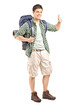 Male hiker with backpack giving a thumb up