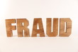 FRAUD text animation with wooden letters version 1