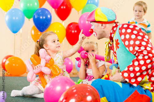 Photo: happy children and clown on birthday party happy children and clown on birthday party