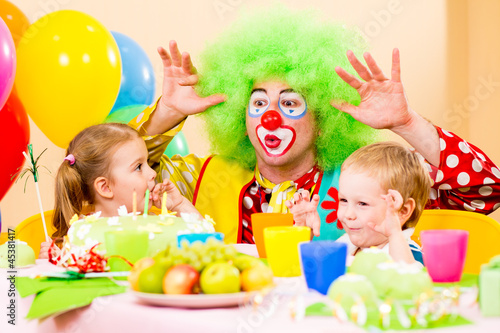 Photo: happy kids with clown on birthday party happy kids with clown on birthday party