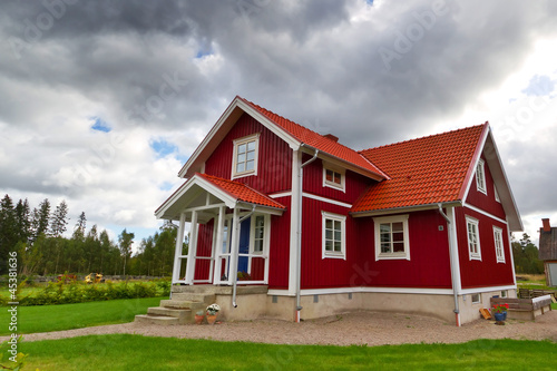 Photo: Traditional red Swedish cottage house Traditional red Swedish cottage house