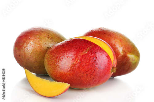 Photo: Ripe appetizing mango isolated on white Ripe appetizing mango isolated on white