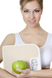 Foto: Beautiful girl with apple in hand Beautiful girl with apple in hand