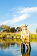 woman fishing in pond
