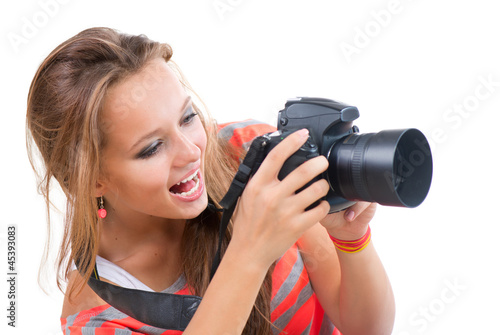 Photo: Teenage Girl with Professional Photo Camera. Isolated on white Teenage Girl with Professional Photo Camera. Isolated on white