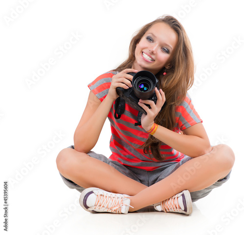 Photo: Teenage Girl with Professional Photo Camera. Isolated on white Teenage Girl with Professional Photo Camera. Isolated on white
