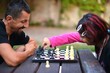 young couple playing chess game