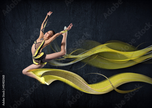 Photo: Young woman in gymnast suit posing Young woman in gymnast suit posing