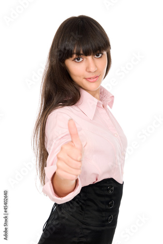 Photo: Young beautiful business woman showing thumbs up gesture Young beautiful business woman showing thumbs up gesture