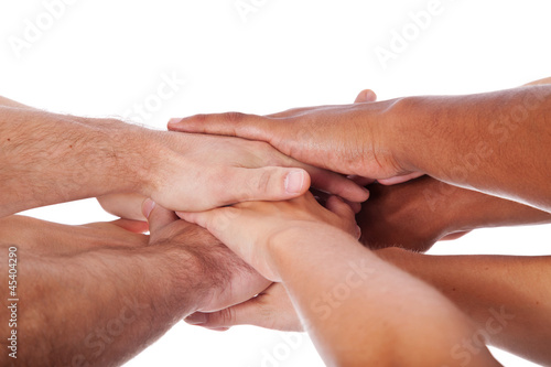 Photo: Diverse Personen legen die Hände aufeinander Diverse Personen legen die Hände aufeinander