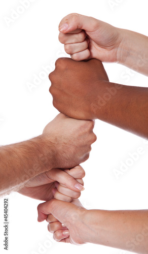 Photo: Diverse Personen setzen ihre Hände übereinander Diverse Personen setzen ihre Hände übereinander