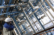 refinery worker and pipelines, inside oil and gas refinery