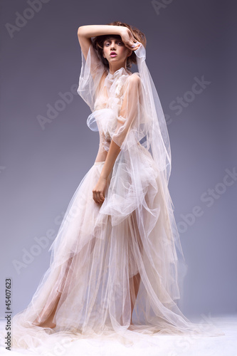 Photo: Beauty fashion woman in retro vintage white classic dress Beauty fashion woman in retro vintage white classic dress
