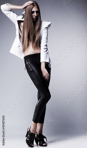 Photo: Young woman in black leggings posing. Glamour, beauty style Young woman in black leggings posing. Glamour, beauty style
