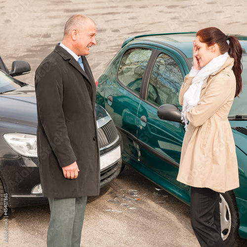 Photo: Man and woman talking after car crash Man and woman talking after car crash