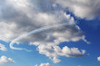 Planes flying in blue cloudy sky