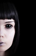 Pale ghost with black eyes
