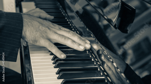 Photo: Detail of Hand playing Piano Detail of Hand playing Piano
