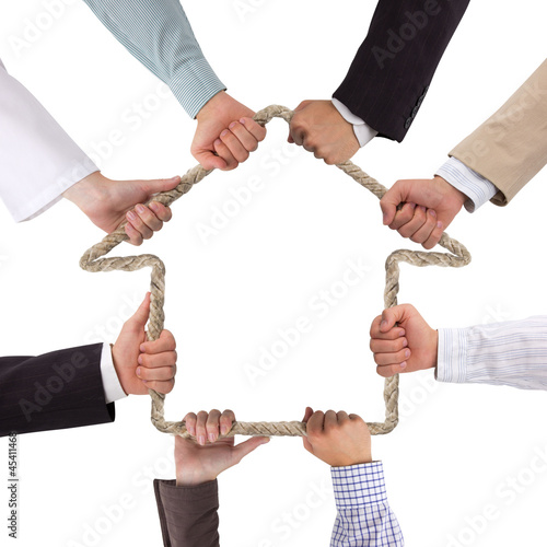Photo: Hands holding rope forming house Hands holding rope forming house