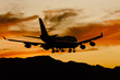 Foto: Aircraft Landing At Sunset Aircraft Landing At Sunset