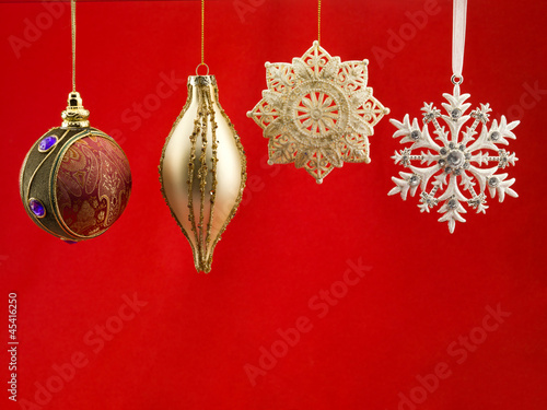 Photo: christmas bauble against red background christmas bauble against red background