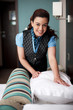 Housekeeping staff rearranging room before customers arrival