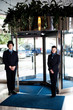 Door man with receptionist at the entrance