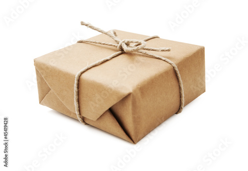 Photo: Parcel wrapped with brown paper and tied with string Parcel wrapped with brown paper and tied with string