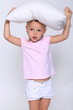 Photo: little girl with a pillow on her head little girl with a pillow on her head