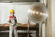 builder worker operating demolition machine