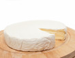Circle Brie  cheese on wooden desk isolated