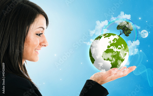 Photo: Woman holding the world in her hand Woman holding the world in her hand