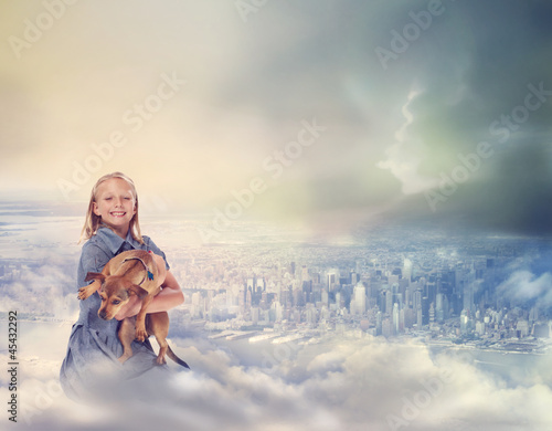Photo: Young Blonde Girl with her Dog on Clouds Young Blonde Girl with her Dog on Clouds