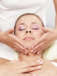 Pretty young wife receives a face treatment - isolated
