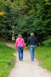 Young couple walking in autumnal park together