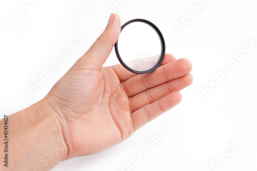 Photo: light filter photograph in hand on isolated white background light filter photograph in hand on isolated white background