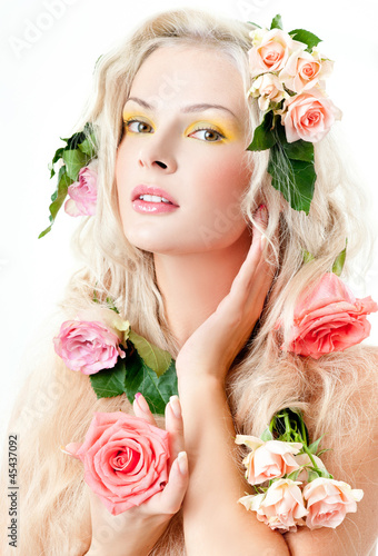 Photo: beautiful blonde with flowers in her hair beautiful blonde with flowers in her hair